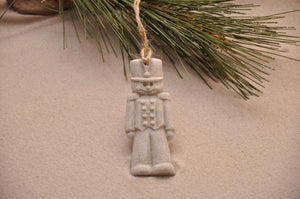 HOLIDAY NUTCRACKER ORNAMENT, HOLIDAY TOY SOLDIER, CHRISTMAS NUTCRACKER, XMAS NUTCRACKER, HOLIDAY GIFT, SEASIDE CHRISTMAS, CHRISTMAS ORNAMENT, SEASONAL DÉCOR, HOLIDAY ORNAMENT, SAND ORNAMENT, TROPICAL SEASIDE ORNAMENT, COASTAL BEACH GIFT, MADE IN FLORIDA, BEACH LOVER GIFTS, BEACH SAND KEEPSAKES, VACATION SOUVENIR, GIFT SHOP OWNERS, PROMOTIONAL ITEMS, PARTY FAVOR, SPECIAL EVENT, COLLECTIBLES, HAND-CRAFTED, FUNDRAISER
